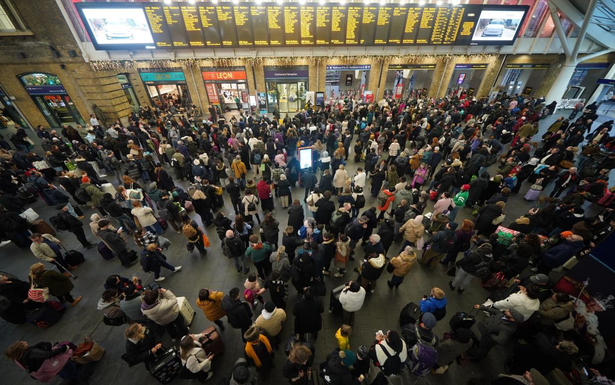 Passengers at King's Cross station in London as rail engineering work projects caused major disruption at Christmas