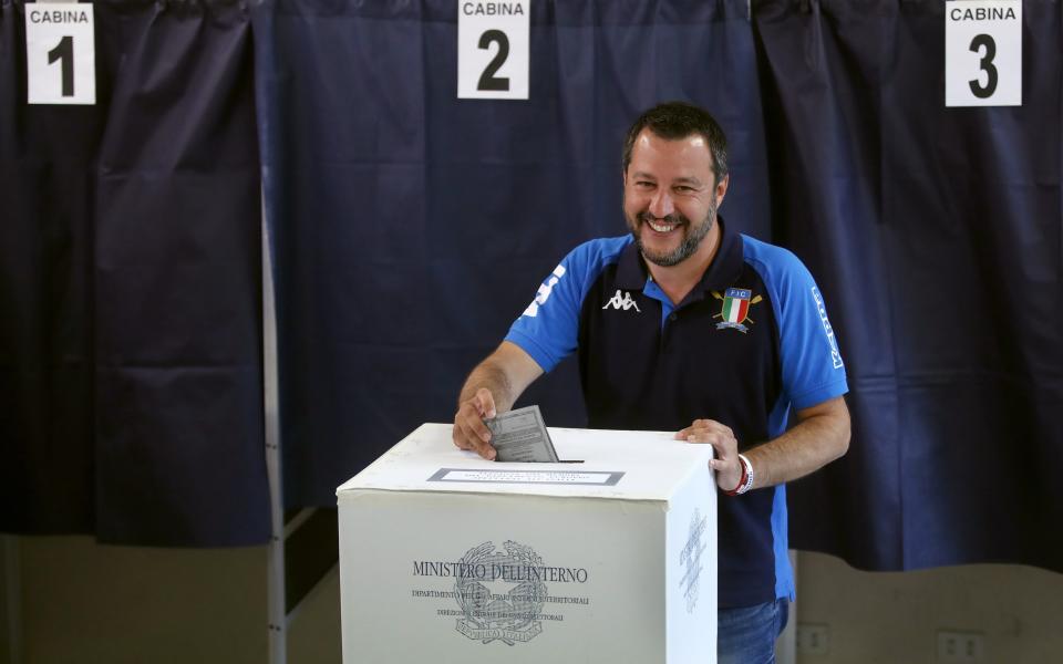 Italian Interior Minister and Deputy Premier Matteo Salvini, of the League, casts his ballot for the European Parliament elections, at a polling station in Milan, Italy, Sunday, May 26, 2019. Pivotal elections for the European Union parliament reach their climax Sunday as the last 21 nations go to the polls and results are announced in a vote that boils down to a continent-wide battle between euroskeptic populists and proponents of closer EU unity. (AP Photo/Antonio Calanni)