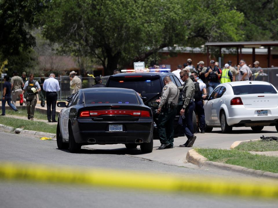 Law enforcement officers guard the scene of a shooting at Robb Elementary School in Uvalde, Texas, U.S. May 24, 2022. REUTERS/Marco Bello