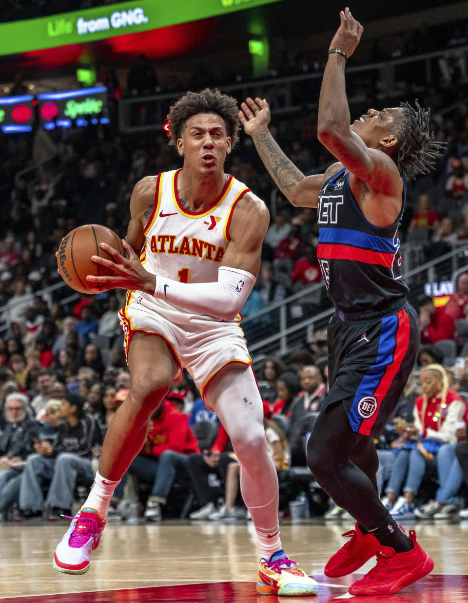 Atlanta Hawks forward Jalen Johnson (1) goes for layup against Detroit Pistons guard Marcus Sasser (25) during the second half of an NBA basketball game, Wednesday, April 3, 2024, in Atlanta. (AP Photo/Jason Allen)