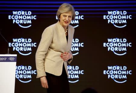 Britain's Prime Minister Theresa May leaves after her address to the World Economic Forum (WEF) annual meeting in Davos, Switzerland January 19, 2017. REUTERS/Ruben Sprich