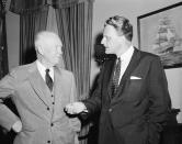 <p>Evangelist Billy Graham talks with U.S. President Dwight Eisenhower at the White House in May 1957. (Photo: AP) </p>