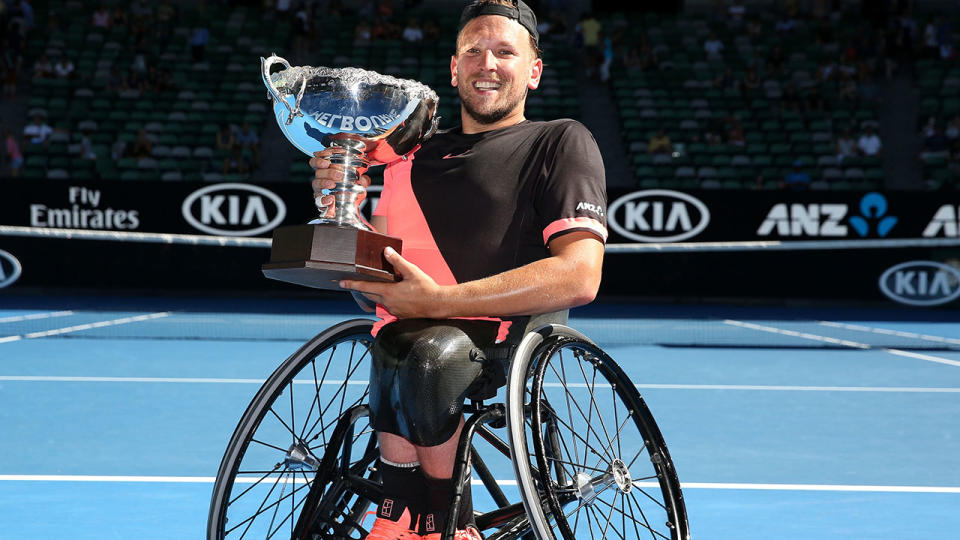 Dylan Alcott poses with the championship trophy after winning the Quad Wheelchair Singles Final during the 2018 Australian Open. (Photo by Michael Dodge/Getty Images)