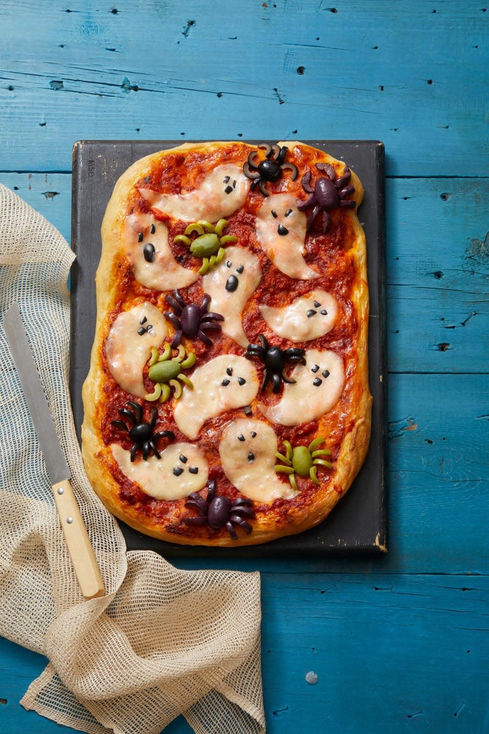 <p>Normally bugs on your food is a turn off — but not when they're made of olives. And if olives aren't your thing, you can still enjoy a cheesy, ghostly pizza.</p><p><a href="https://www.womansday.com/food-recipes/a33564112/ghostly-pizza-recipe/" rel="nofollow noopener" target="_blank" data-ylk="slk:Get the Ghostly Pizza recipe.;elm:context_link;itc:0;sec:content-canvas" class="link "><em><strong>Get the Ghostly Pizza recipe.</strong></em></a></p>