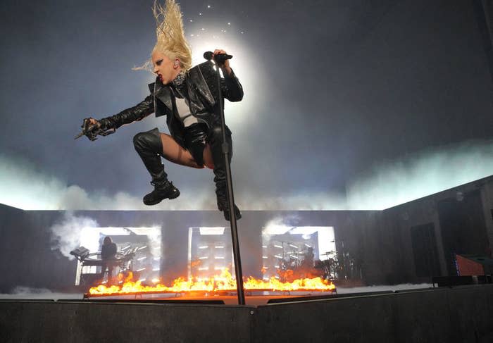 Lady Gaga jumping in the air during a performance