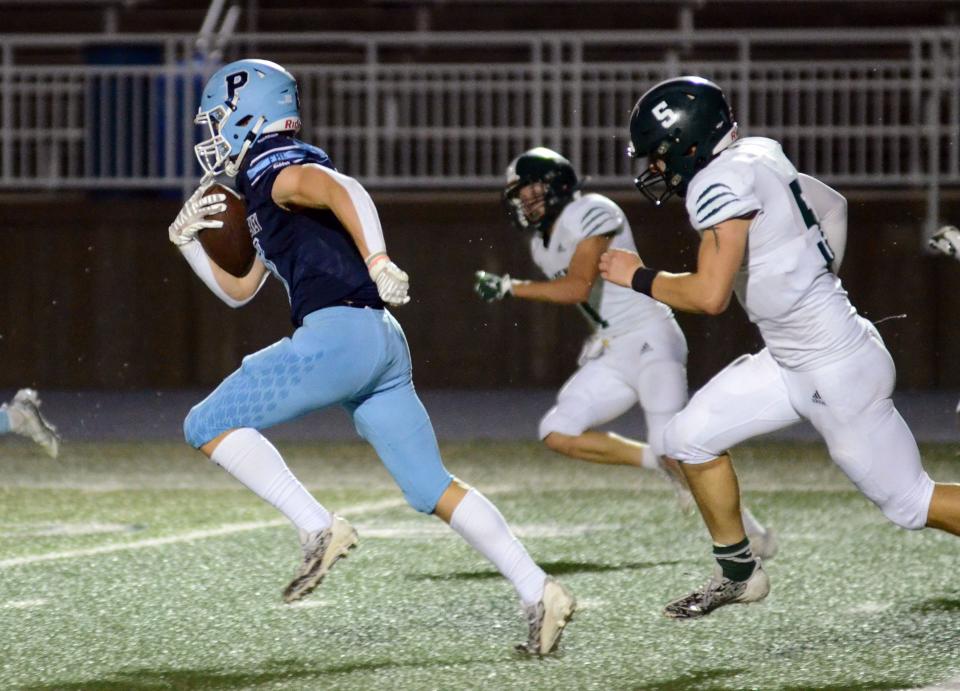 Petoskey wideout Seth Marek turns up field for what became a 98-yard touchdown reception against Alpena Friday night.