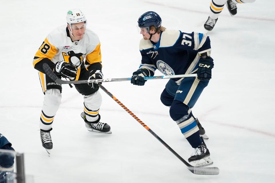 Mar 30, 2024; Columbus, Ohio, USA; Columbus Blue Jackets right wing Cameron Butler (37) skates by Pittsburgh Penguins left wing Drew O'Connor (10) during the second period of the NHL hockey game at Nationwide Arena.