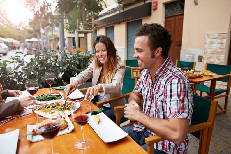 Couple sharing food at a european style restaurant