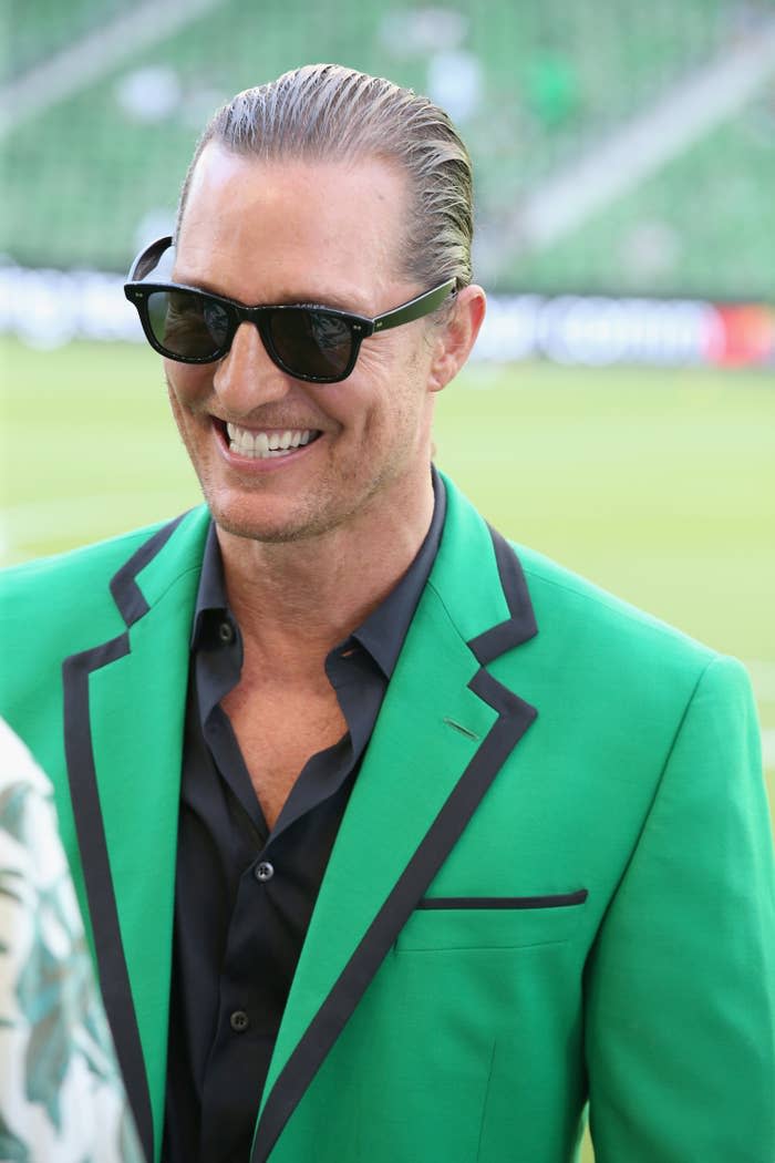 Matthew smiling and wearing a blazer and sunglasses