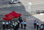 Police officers man a check point into the Legislative Council in Hong Kong on Friday, June 14, 2019. Calm appeared to have returned to Hong Kong after days of protests by students and human rights activists opposed to a bill that would allow suspects to be tried in mainland Chinese courts. (AP Photo/Vincent Yu)