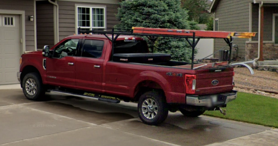 A maroon 2017 Ford F-350 pickup with a Colorado license plate of ARD-833