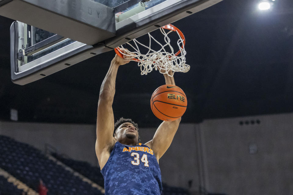 UTEP forward Kevin Kalu (34) dunks on Western Kentucky during the first half of an NCAA college basketball game at the Conference USA Tournament final, Saturday, March 16, 2024, in Huntsville, Ala. (AP Photo/Vasha Hunt)