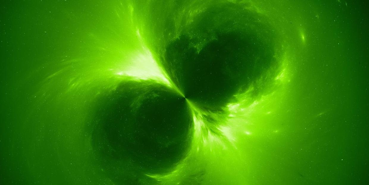 green glowing electromagnetic source in space