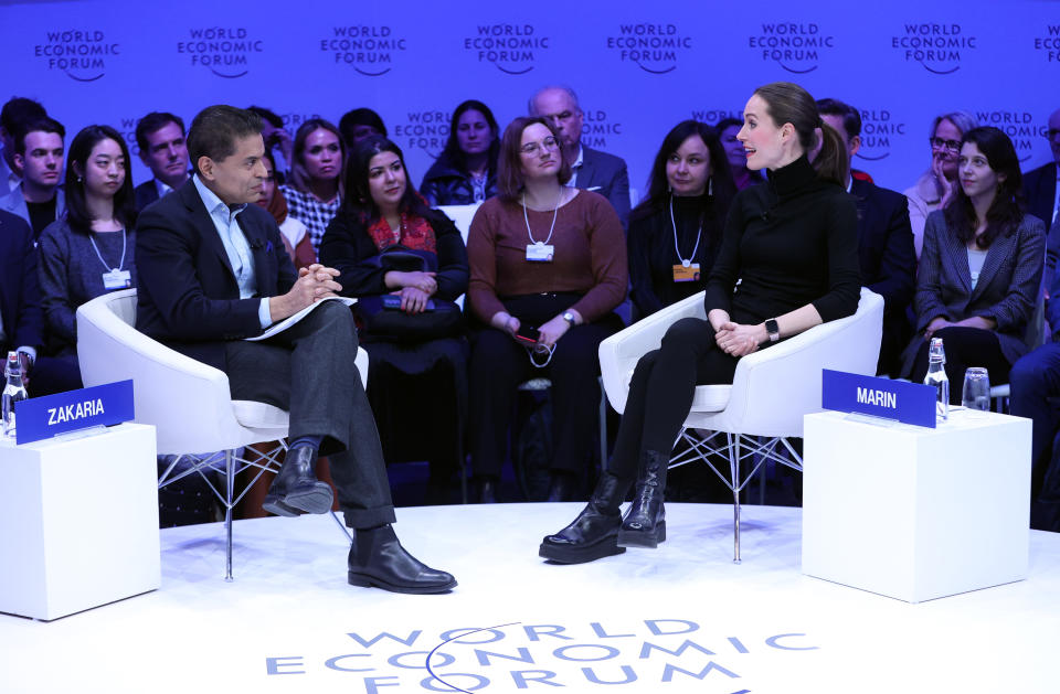 DAVOS, SWITZERLAND - JANUARY 17: Prime Minister of Finland Sanna Marin (R) speaks at the World Economic Forum (WEF) in Davos, Switzerland on January 17, 2023. (Photo by Dursun Aydemir/Anadolu Agency via Getty Images)