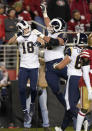 Los Angeles Rams wide receiver Cooper Kupp (18) celebrates with Austin Blythe, center, and Austin Corbett after scoring against the San Francisco 49ers during the second half of an NFL football game in Santa Clara, Calif., Saturday, Dec. 21, 2019. (AP Photo/Tony Avelar)
