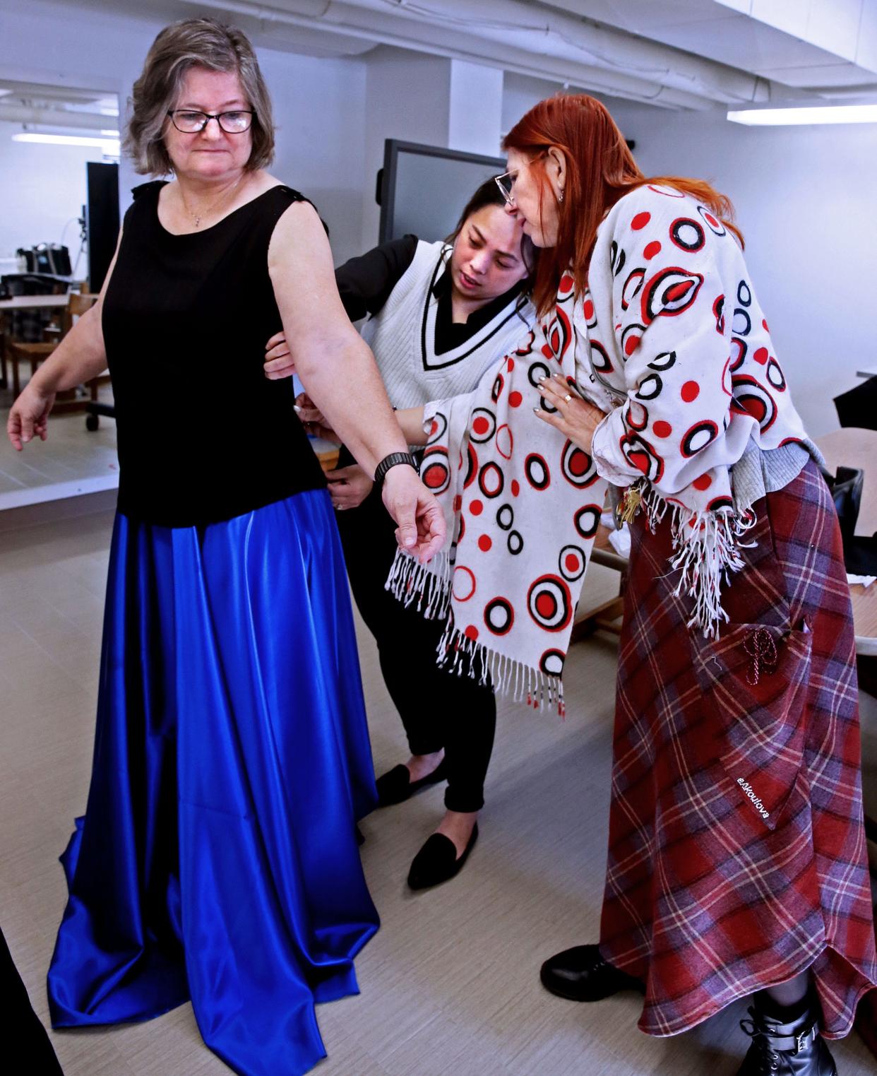 Mount Mary University’s incoming president, Isabelle Cherney, left, is fitted for her evening dress by designer Shoua Xiong, center, who gets input from Elena Pitts, assistant professor from the university. Cherney will wear the evening dress for the reception on the day of her inauguration. Since graduating from the university in 2020, Xiong has been teaching flat pattern-making at Mount Mary University and working in bridal alterations at Eva’s Bridal.