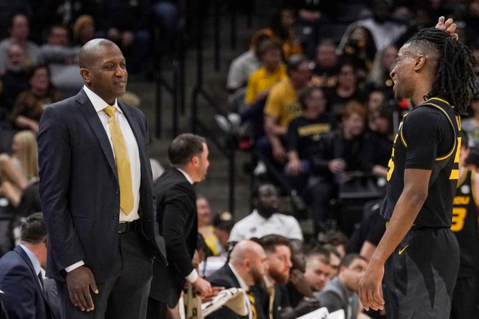 Mar 2, 2024; Columbia, Missouri, USA; Missouri Tigers head coach Dennis Gates talks with guard Sean East II (55) against the Mississippi Rebels during the first half at Mizzou Arena. Mandatory Credit: Denny Medley-USA TODAY Sports