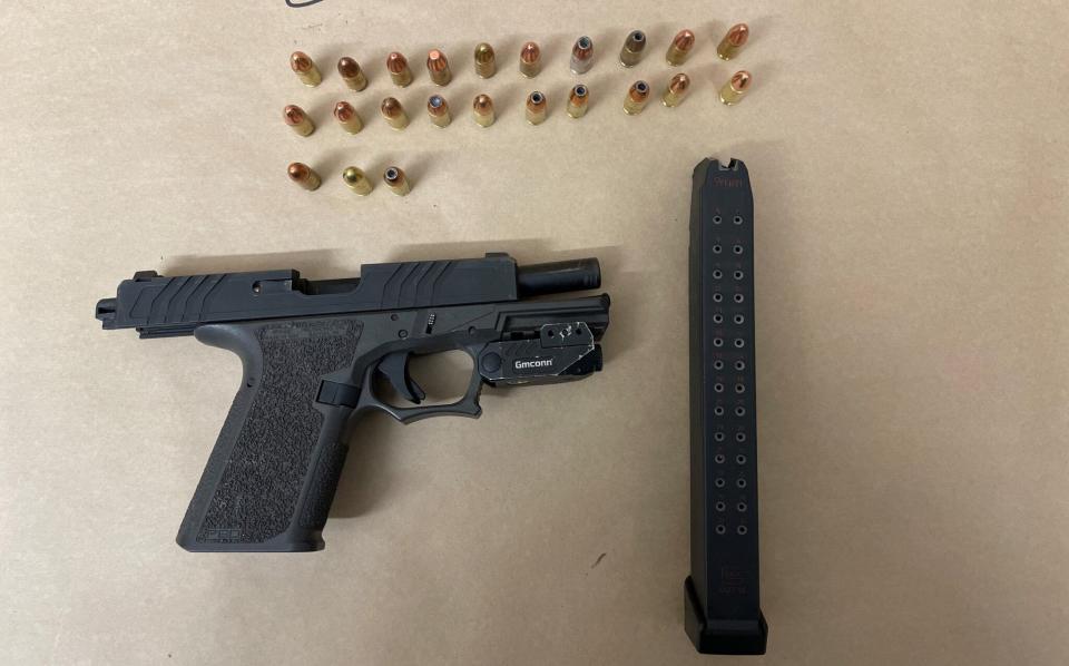 Officers seized a handgun with an extended magazine, which appeared to have been modified to make it fully automatic, from the suspects’ vehicle.