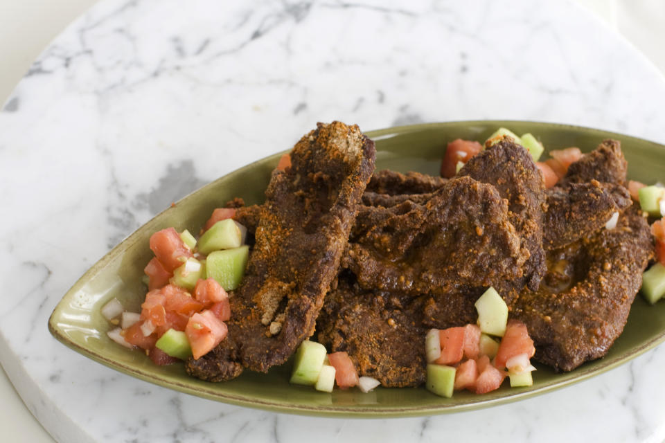 In this image taken on October 15, 2012, beef suya is shown in a serving dish in Concord, N.H. (AP Photo/Matthew Mead)