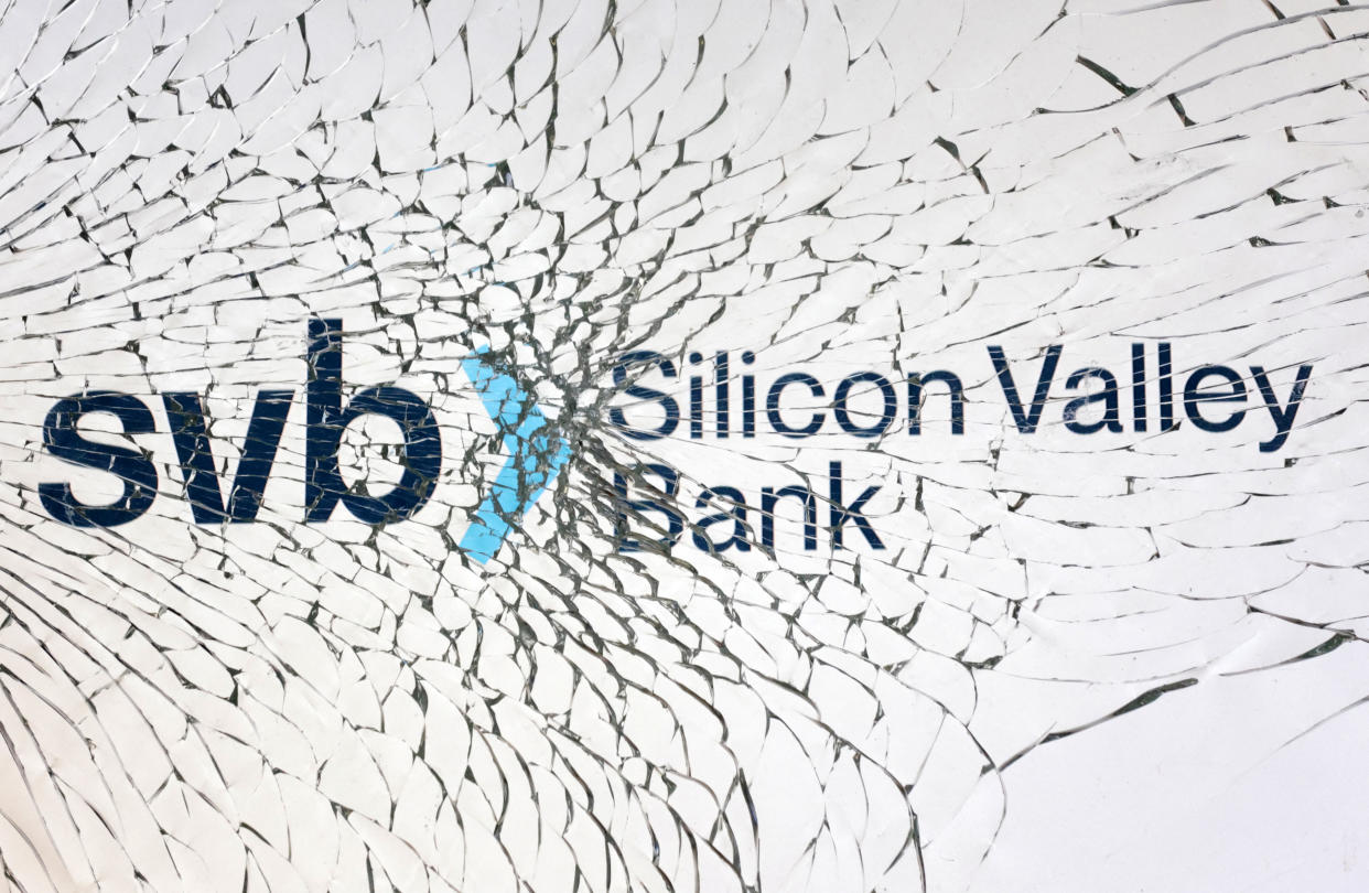 SVB (Silicon Valley Bank) logo is seen through broken glass in this illustration taken March 10, 2023. REUTERS/Dado Ruvic/Illustration
