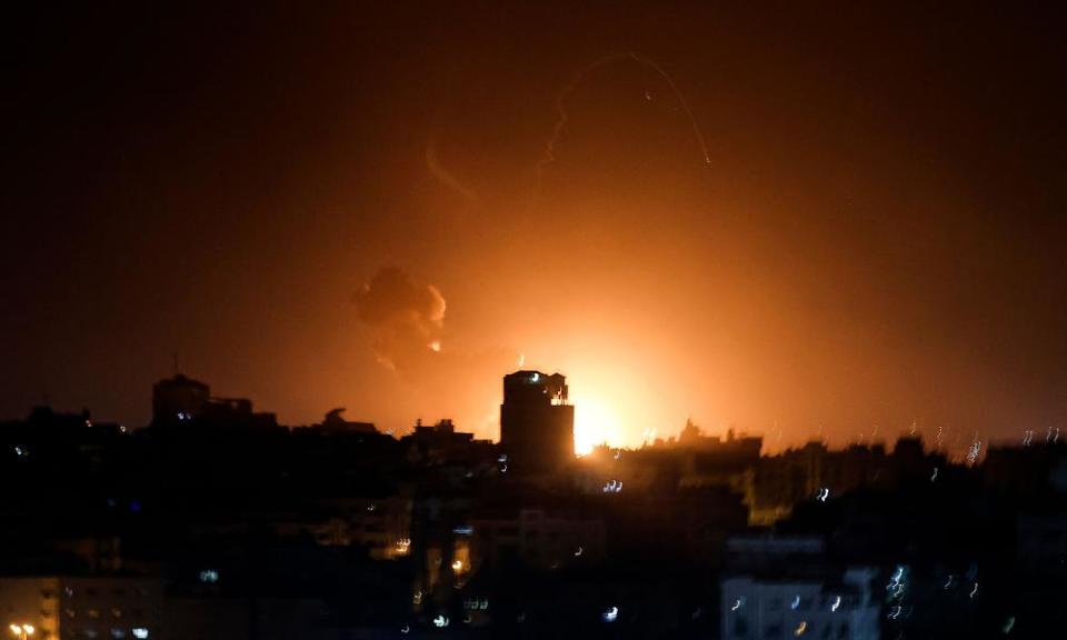 Fire and smoke rise above buildings in Gaza City 