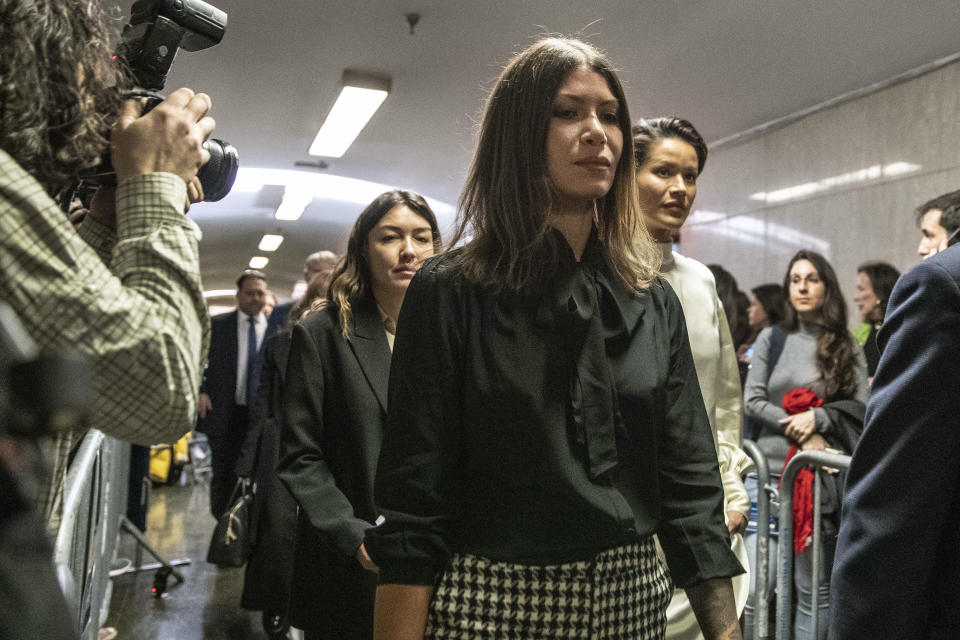 Dawn Dunning, center arrives at court for Harvey Weinstein's sentencing, in New York, Wednesday, March 11, 2020. She is followed by Miriam Haley, background left, and Tarale Wulff, background right. (AP Photo/Richard Drew)