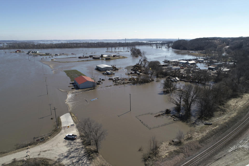 This Wednesday, March 20, 2019 aerial photo shows flooding near the Platte River in in Plattsmouth, Neb., south of Omaha. The National Weather Service is warning that flooding in parts of South Dakota and northern Iowa could soon reach historic levels. A Weather Service hydrologist says "major and perhaps historic" flooding is possible later this month at some spots on the Big Sioux and James rivers. The worst of the flooding so far has been in Nebraska, southwestern Iowa and northwestern Missouri. (DroneBase via AP)