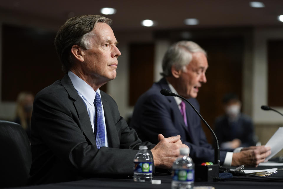U.S. Ambassador to China nominee Nicholas Burns, left, listens as Sen. Ed Markey, D-Mass., speaks in support of Burns' nomination during a Senate Foreign Relations Committee hearing on Capitol Hill in Washington, Wednesday, Oct. 20, 2021. (AP Photo/Patrick Semansky)