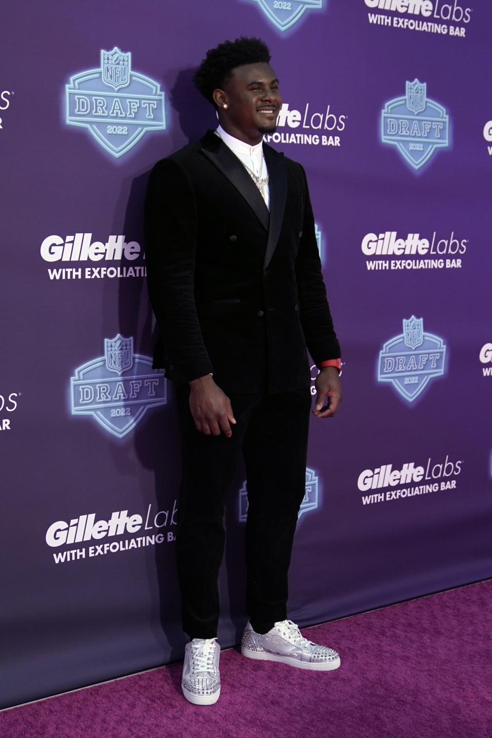 Liberty quarterback Malik Willis poses on the red carpet before the first round of the NFL football draft Thursday, April 28, 2022, in Las Vegas. (AP Photo/Jae C. Hong)