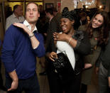 Britain's Prince William dances with Vanessa Boateng (C) as his wife Catherine, Duchess of Cambridge (R) looks on during a reception at Centrepoint's Camberwell Foyer in London December 21, 2011. The national charity, Centrepoint, provides housing and support to improve the lives of homeless young people aged 16 to 25. REUTERS/Ben Stansall/POOL