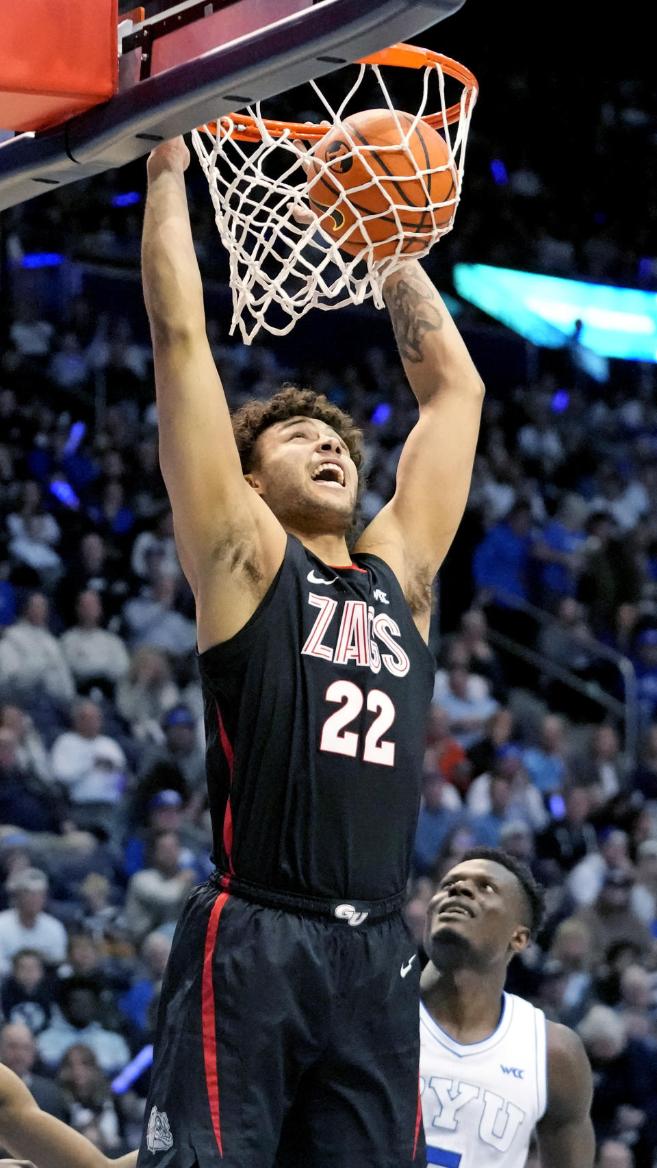 Gonzaga forward Anton Watson (22) dunks against BYU during the first half of an NCAA college basketball game Thursday, Jan. 12, 2023, in Provo, Utah. (AP Photo/Rick Bowmer)