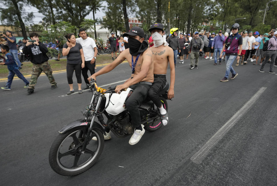 Demonstrators block a highway during a national strike, in Guatemala City, Tuesday, Oct. 10, 2023. People are protesting to support President-elect Bernardo Arévalo after Guatemala's highest court upheld a move by prosecutors to suspend his political party over alleged voter registration fraud. (AP Photo/Moises Castillo)