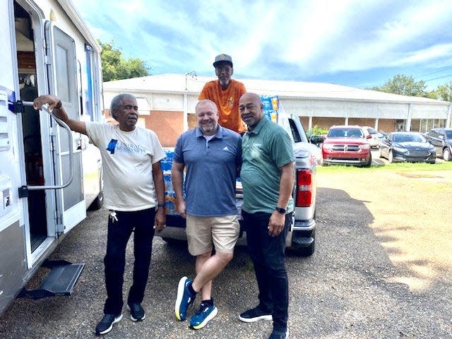 From Central Miss. Health Services team: Robert Porter, Dr. Tim Rush (back row), Michael Adcock, Magnolia Health Plan, and the author, Terrence M.  Shirley, CEO, Community Health Center Association of Mississippi.