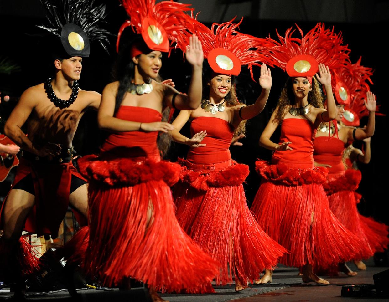 Polynesian Cultural Center dancers perform during the concert/luau for the Honolulu Marathon in Waikiki, Friday, Dec. 12, 2008. (AP/Photo RonenZilberman)