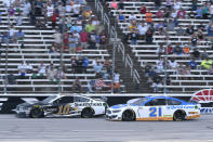 Aric Almirola (10) and Matt DiBenedetto (21) head down the front stretch during the NASCAR All-Star Open Cup Series auto race at Texas Motor Speedway in Fort Worth, Texas, Sunday, June 13, 2021. (AP Photo/Larry Papke)