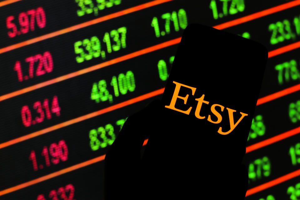 POLAND - 2020/03/13: In this photo illustration an Etsy logo seen displayed on a smartphone. Stock market prices in the background as stock markets tumble all over the world. (Photo by Filip Radwanski/SOPA Images/LightRocket via Getty Images)