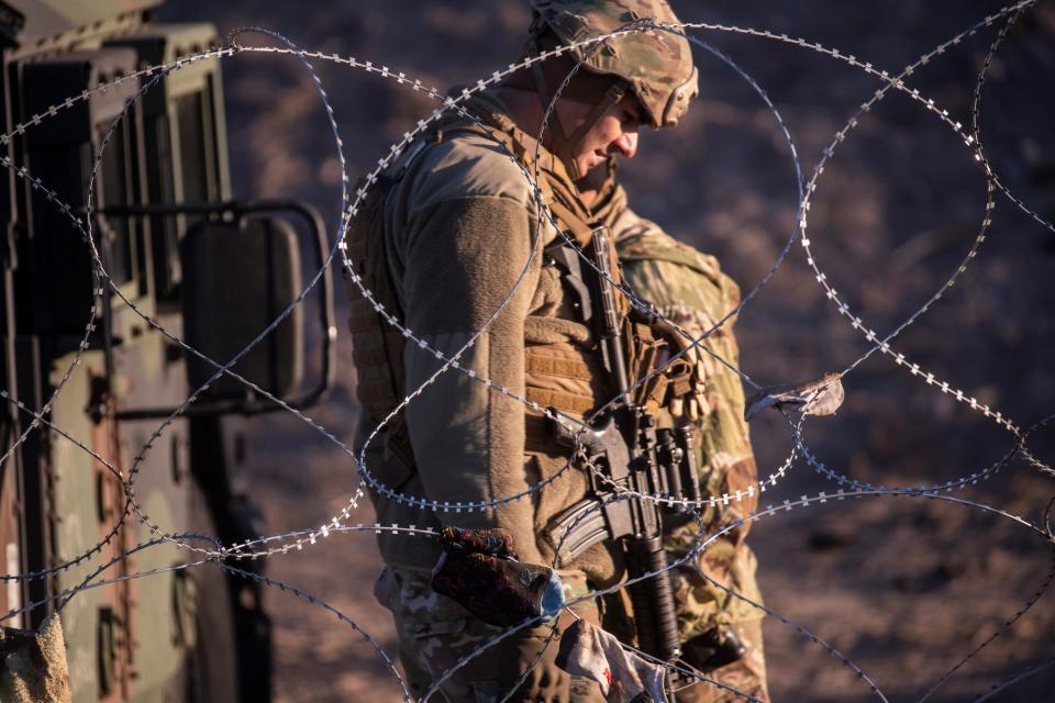 Texas National Guard stands guard on the north bank of the Rio Grande in El Paso, Texas on Dec. 20, 2022. The National Guard was deployed by Texas Governor Abbott in response to large numbers of asylum seekers arriving in El Paso. 