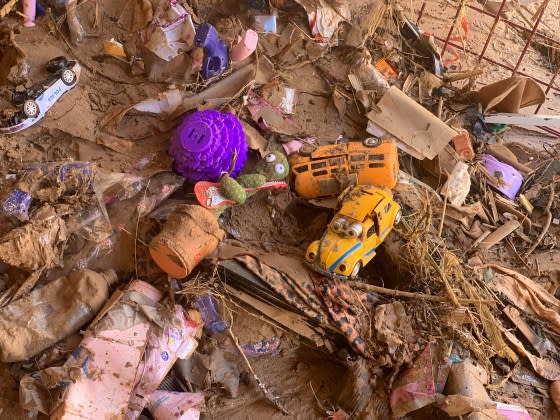 Toys are scattered outside a damaged house in Derna on Sept.14. <span class="copyright">Yousef Murad—AP</span>