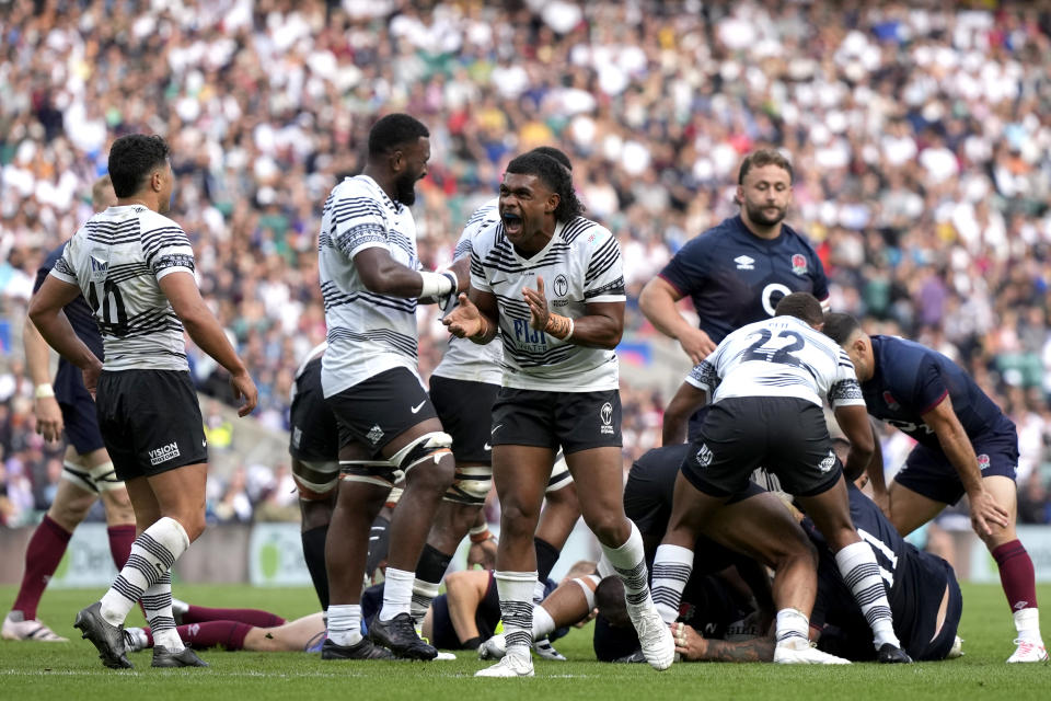 Fiji's Simione Kuruvoli, centre, reacts during the rugby union international match between England and Fiji at Twickenham stadium in London, Saturday, Aug. 26, 2023. Fiji beat England by 22-30. (AP Photo/Alastair Grant)