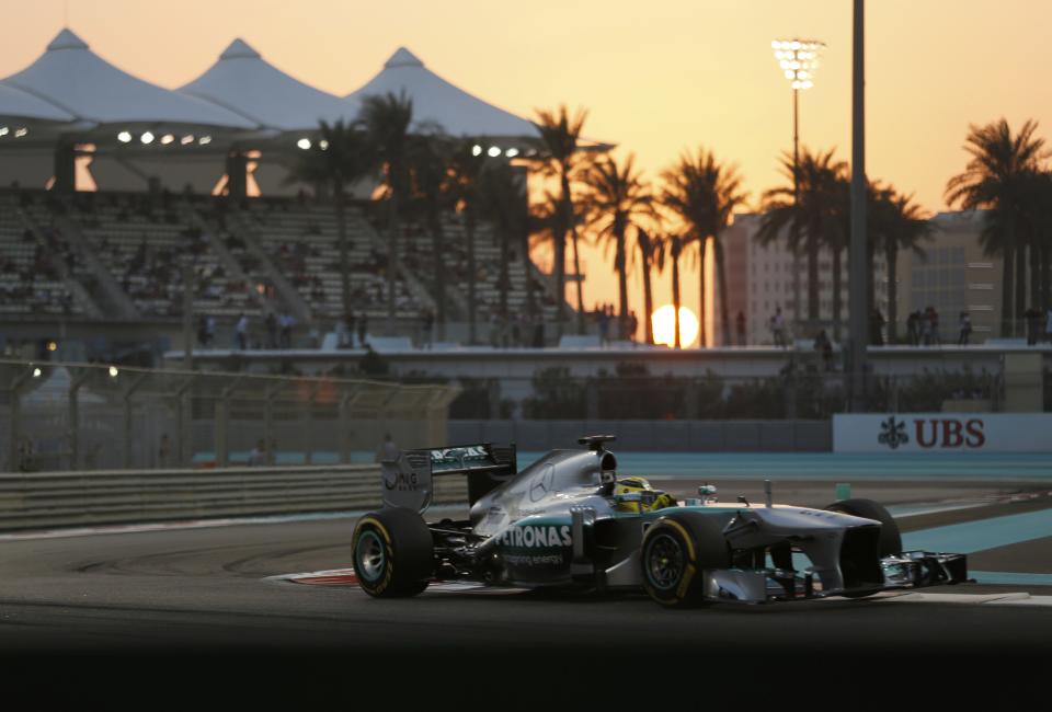 Mercedes Formula One driver Nico Rosberg of Germany takes a corner during the qualifying session of the Abu Dhabi F1 Grand Prix at the Yas Marina circuit on Yas Island, November 2, 2013. REUTERS/Ahmed Jadallah (UNITED ARAB EMIRATES - Tags: SPORT MOTORSPORT F1)