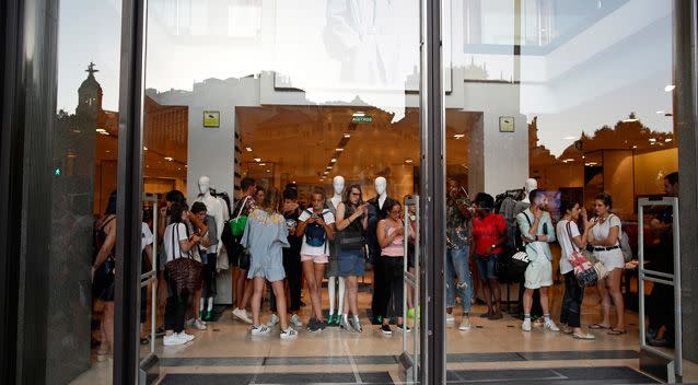 Many took shelter inside nearby shops as the van sped through. Photo: AAP