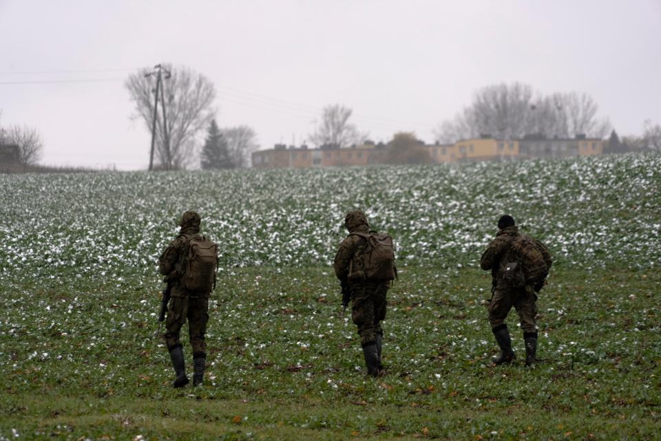 Polish soldiers search for missile wreckage near the place where a missile struck in Przewodow (Copyright 2020 The Associated Press. All rights reserved)