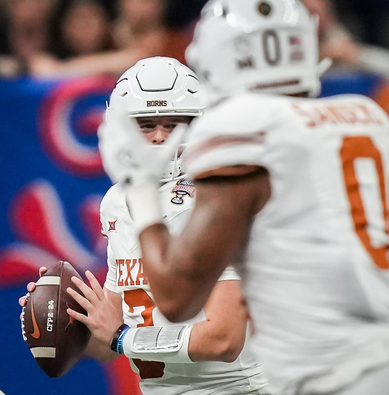 Texas quarterback Quinn Ewers looks to throw to tight end Ja'Tavion Sanders during the Sugar Bowl loss to Washington in the CFP semifinals. Sanders will be taken in next week's NFL draft and leaves Texas as perhaps the program's best ever tight end.