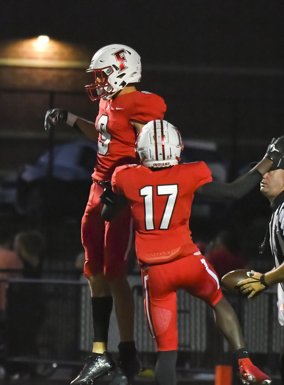 Isaiah Glover (9) and Michael Figgins (17) of Fairfield celebrate after a touchdown during the Skyline Chili Crosstown Showdown against Wayne at Fairfield Stadium on Thursday, Aug. 18, 2022.