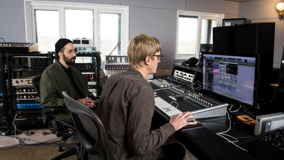 Two men working in a recording studio