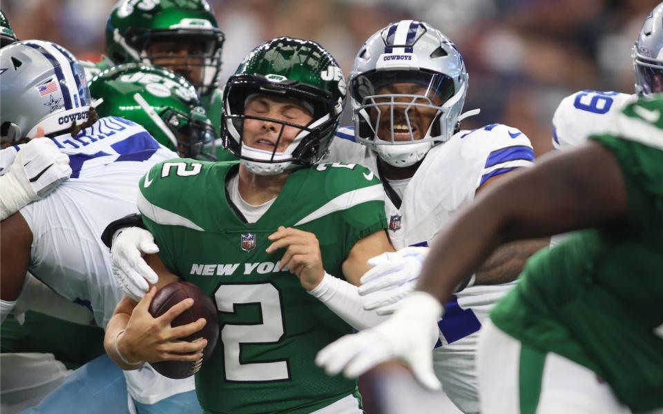 Sep 17, 2023; Arlington, Texas, USA; New York Jets quarterback <a class="link " href="https://sports.yahoo.com/nfl/players/33390" data-i13n="sec:content-canvas;subsec:anchor_text;elm:context_link" data-ylk="slk:Zach Wilson;sec:content-canvas;subsec:anchor_text;elm:context_link;itc:0">Zach Wilson</a> (2) is sacked by Dallas Cowboys linebacker Micah Parsons (11) in the first quarter at AT&T Stadium. Mandatory Credit: Tim Heitman-USA TODAY Sports