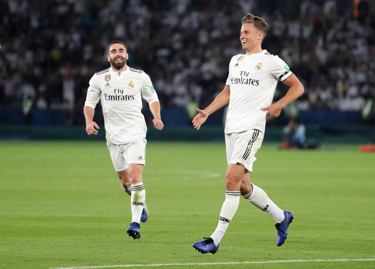 Soccer Football - Club World Cup - Final - Real Madrid v Al Ain - Zayed Sports City Stadium, Abu Dhabi, United Arab Emirates - December 22, 2018  Real Madrid's Marcos Llorente celebrates scoring their second goal with Dani Carvajal         REUTERS/Suhaib Salem