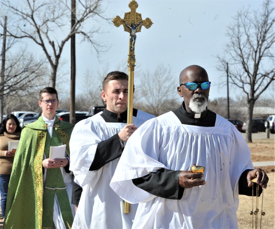 Deacon Moses leads the procession during the Saint Benedict Orthodox Church blessing ceremony at Lake Wichita.