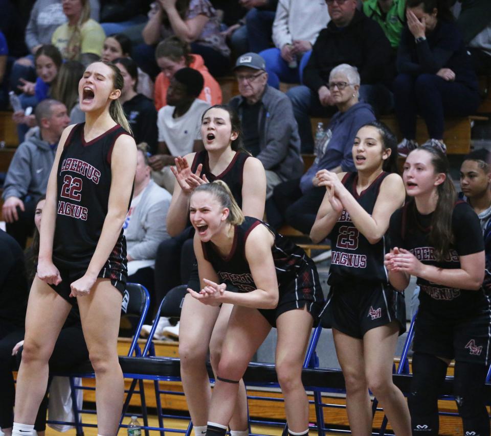 Players from Albertus Magnus cheer on their teammates during the New York State Class AA regional girls basketball final versus Wallkill on March 8, 2024.