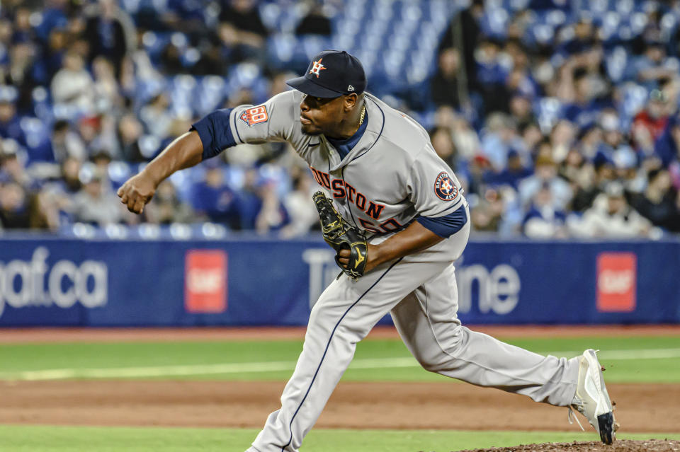 Houston Astros relief pitcher Hector Neris throws during the ninth inning of the team's baseball game against the Toronto Blue Jays on Friday, April 29, 2022, in Toronto. (Christopher Katsarov/The Canadian Press via AP)